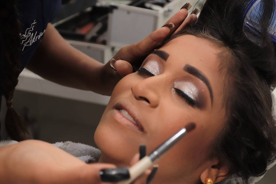A makeup artist doing the eyebrow